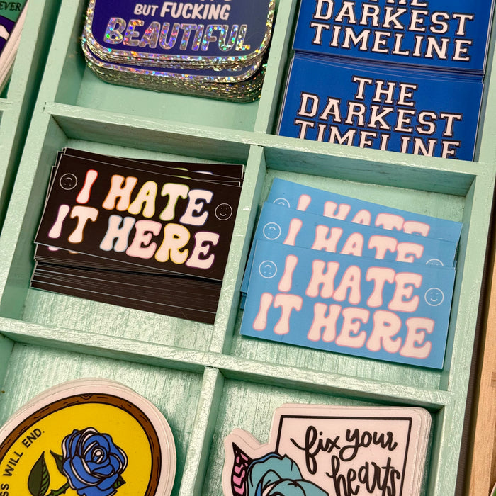 I Hate It Here Vinyl Sticker - Inclusive Pride Flag Colors