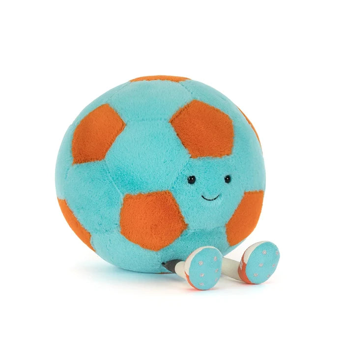 Plush toy soccer foot ball with a smiling face on a white background
