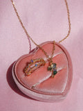 Necklace with a pendant on a pink heart-shaped cushion