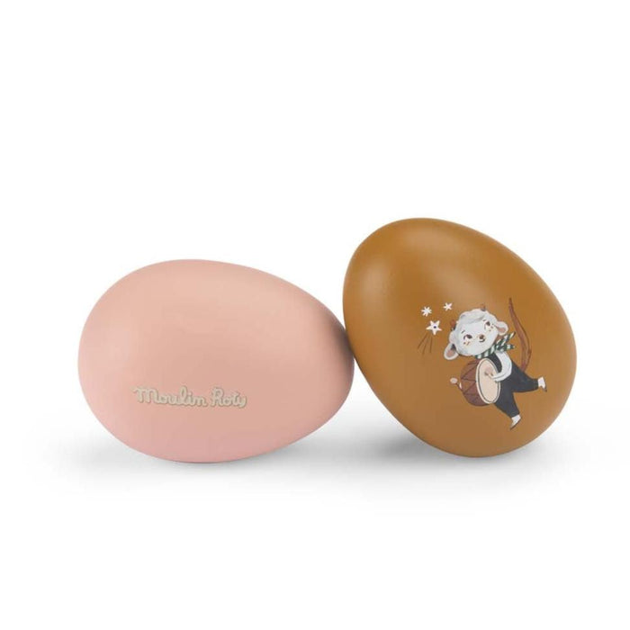 pink and brown wooden eggs with lamb motif on a white background