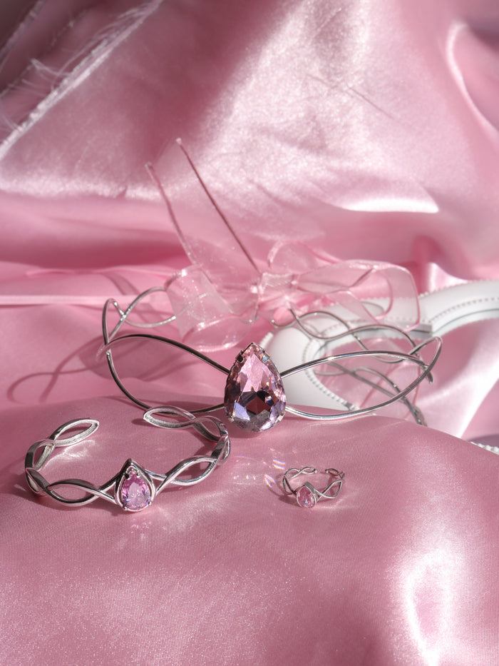 Odette Set, Swan Princess Set, Swan Princess Tiara, Bracelet and Ring Set with pink gemstones on a pink satin background