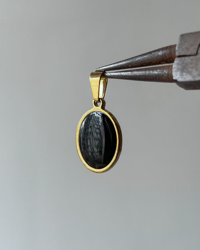 Oval Gold charm