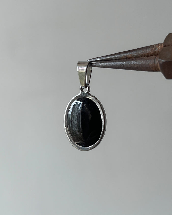 Oval silver charm