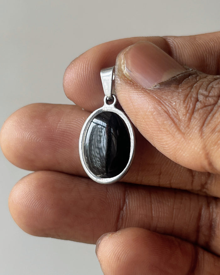Oval silver charm