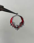 Red bat wing charm