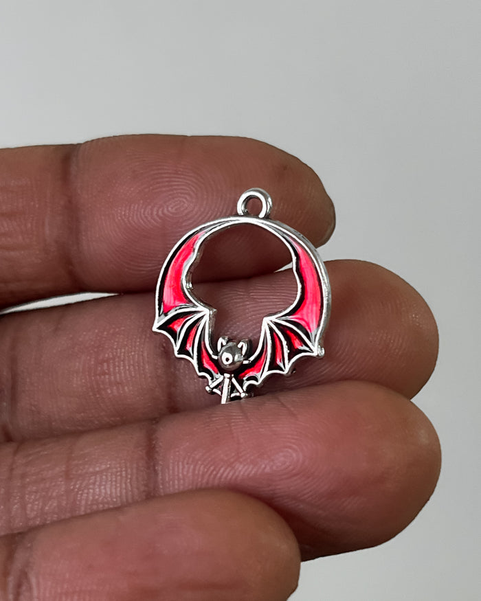 Red bat wing charm