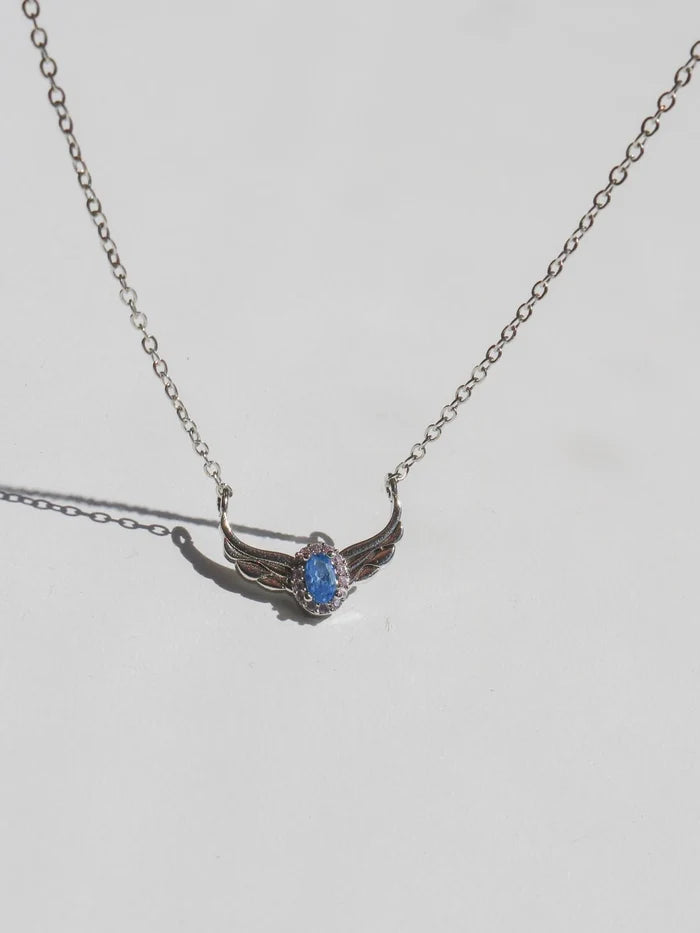 Swan Princess Necklace with a blue pendant on a light gray background