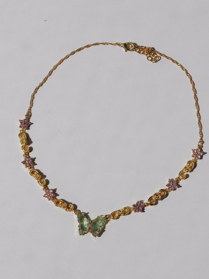 Tinkerbell Flower Choker necklace with multicolored stones and a butterfly pendant.
