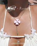 Bloom with Flora's natural magic wearing the Winx Club® Flora Flower Lariat Necklace. Officially licensed jewelry inspired by the Fairy of Nature, featuring an elegant floral lariat design.